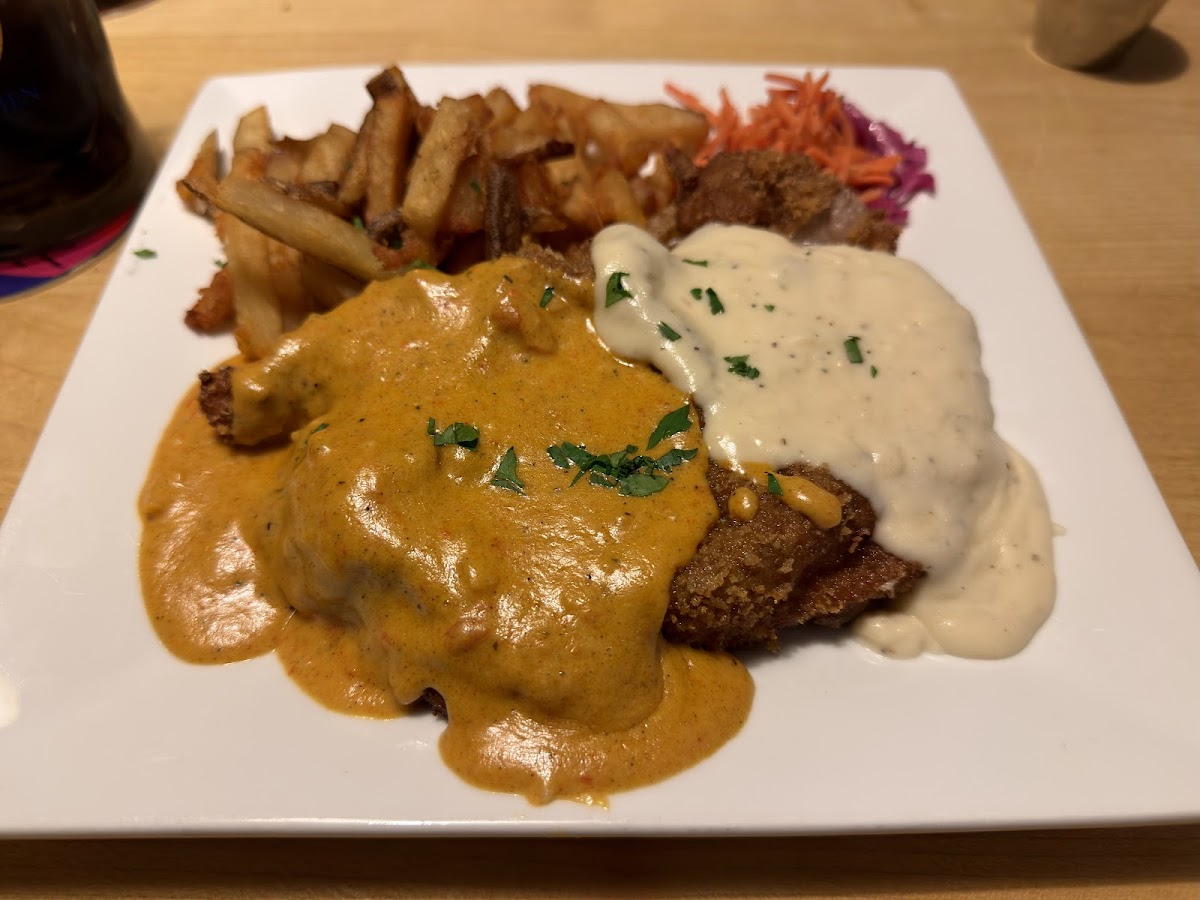 Schnitzel Heaven and Hell with two sauces, fries and slaw