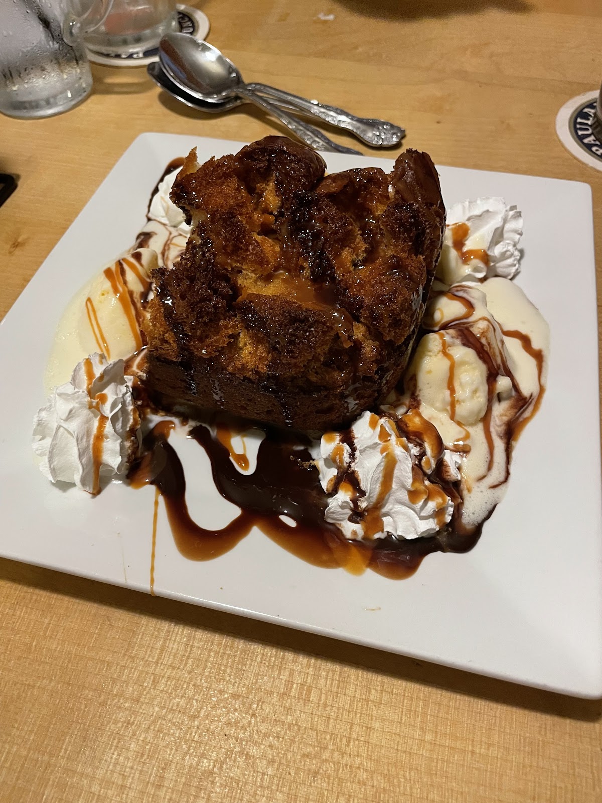 Warm bread pudding with vanilla ice cream and caramel